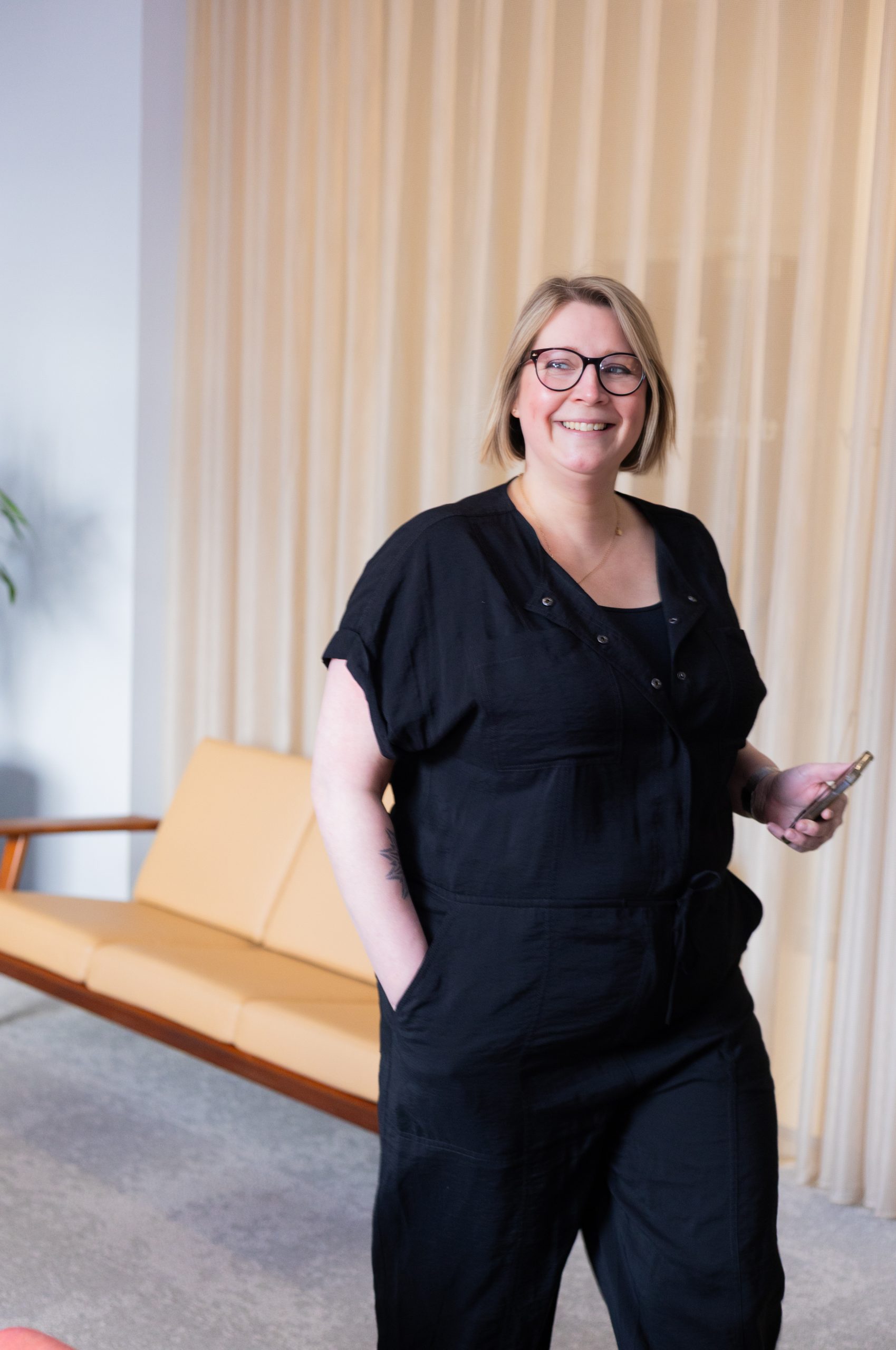Fully Length Picture of Jacqui Kemp, black top and trousers, smiling